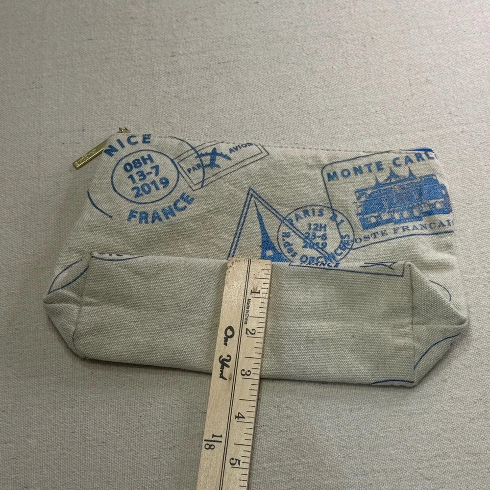 Lancôme Paris canvas cosmetic bag - blue passport stamp design